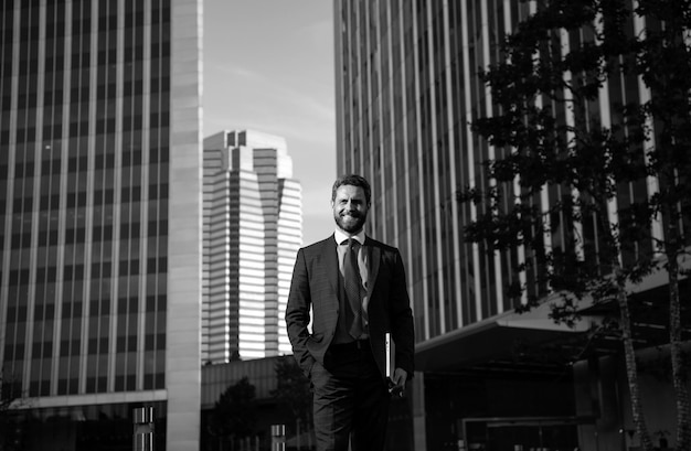 Portrait of businessman in front of modern office