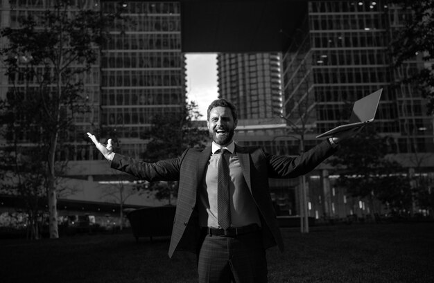 Portrait of businessman in front of modern office