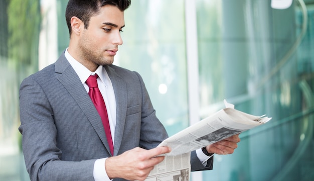 Portrait of a businessman reading a newspaper