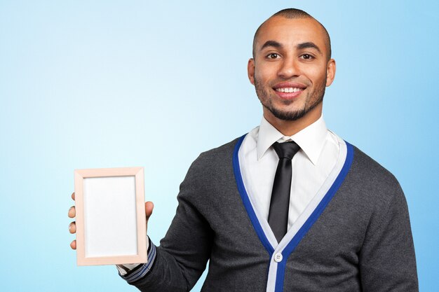 Portrait of a businessman showing a blank business card