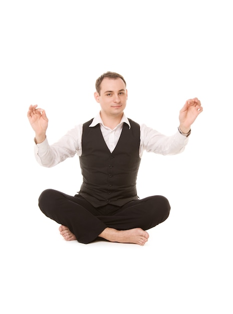 Portrait of businessman sitting in lotus pose