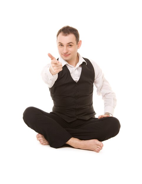 Portrait of businessman sitting in lotus pose