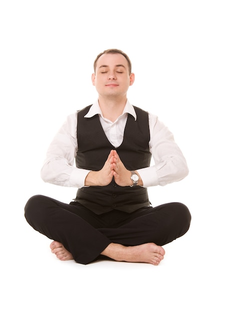 Portrait of businessman sitting in lotus pose