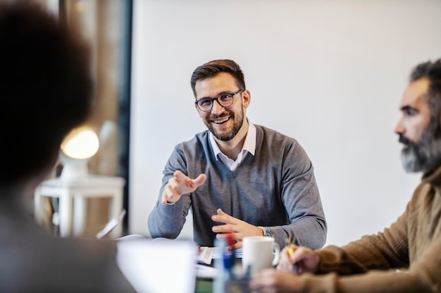 Portrait of a businessman talking on a meeting at boardroom