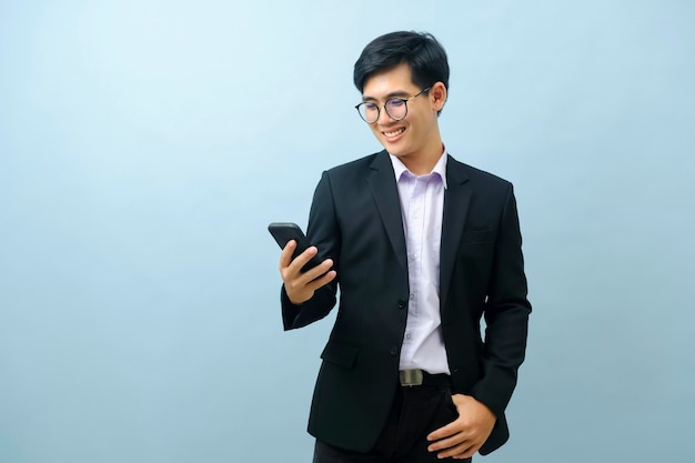 Portrait of businessman using smartphone