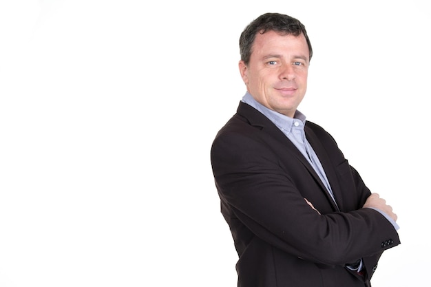 Portrait of a businessman wearing a suit smiling with his arms folded