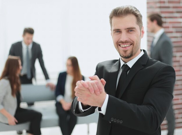 Portrait of a businessman welcoming in the office