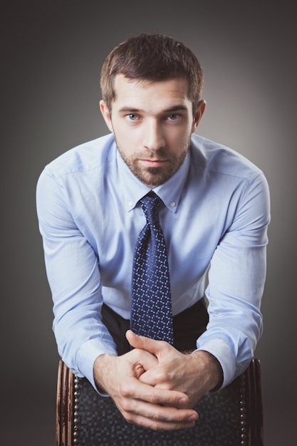 Photo portrait of businessman with beard in suit. studio.