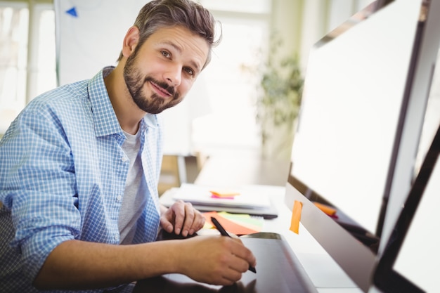 Portrait of businessman working in creative office