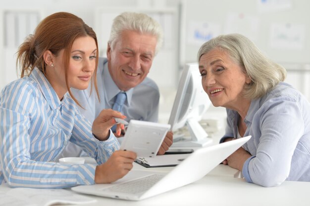 Portrait of businesspeople working in modern light office