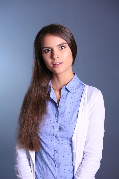 Portrait of a businesswoman against dark background Woman smiling