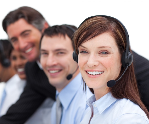 Portrait of a businesswoman and her team working in a call center