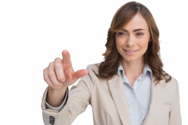 Portrait of businesswoman pointing her finger at camera
