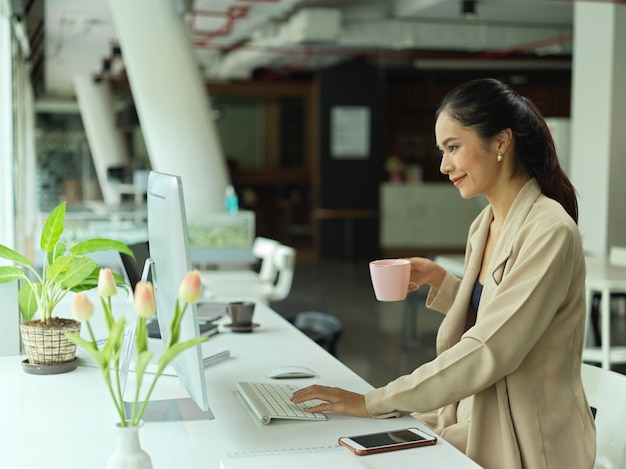 Portrait of businesswoman sitting in office room