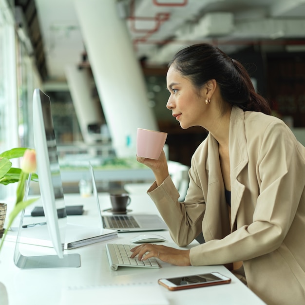 Portrait of businesswoman sitting in office room