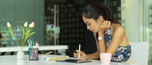 Portrait of businesswoman sitting in office room