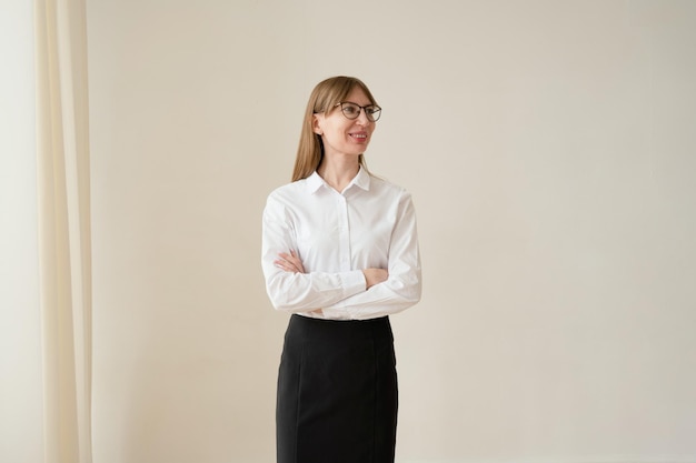 Portrait of a businesswoman in a white shirt and black skirt