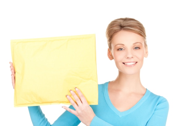 Portrait of businesswoman with parcel over white wall