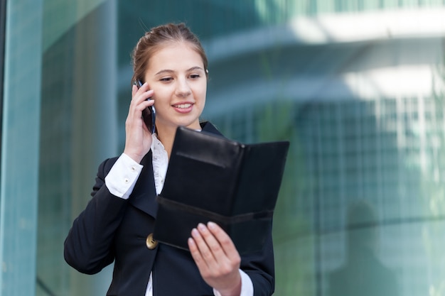 Portrait of a busy businesswoman at work