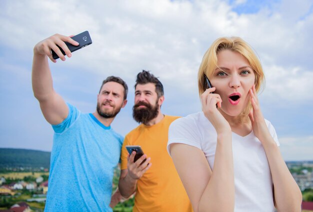 Portrait of busy people talking on the mobile phone Friends gro