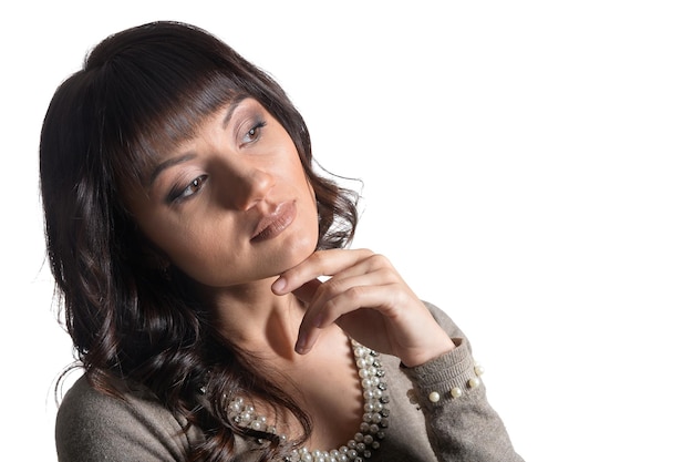 Portrait of calm young woman   isolated on white background