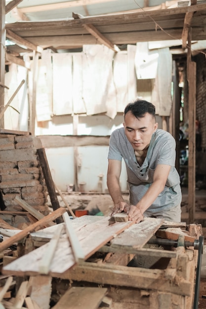 Portrait of a carpenter in his workspace