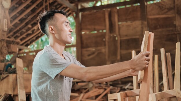 Portrait of a carpenter in his workspace