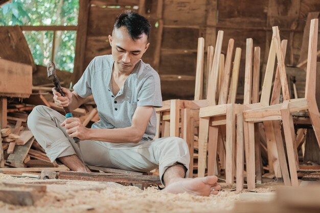 Portrait of a carpenter in his workspace