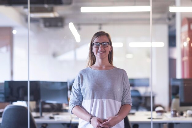 portrait of casual business woman at her modern start up business office interior