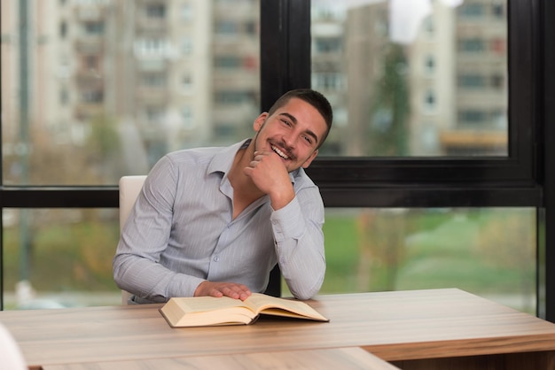 A Portrait Of An Caucasian College Student Man In Library  Shallow Depth Of Field