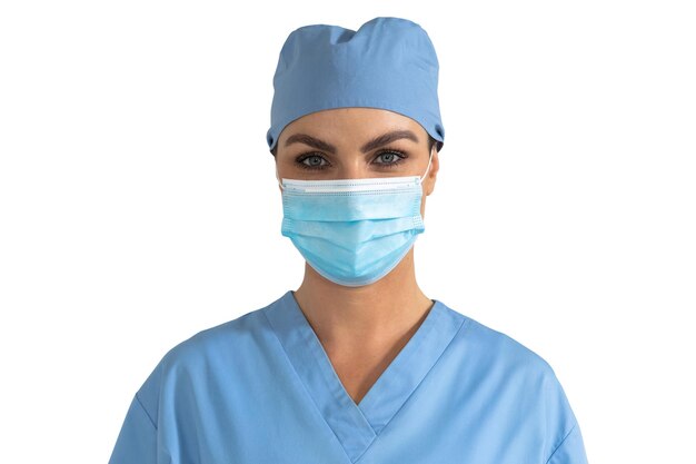 Photo portrait of caucasian female doctor wearing face mask and scrubs looking at camera on white background. medicine health coronavirus covid 19 pandemic.