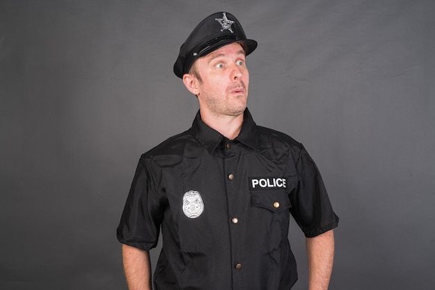 Portrait of Caucasian man wearing police uniform costume