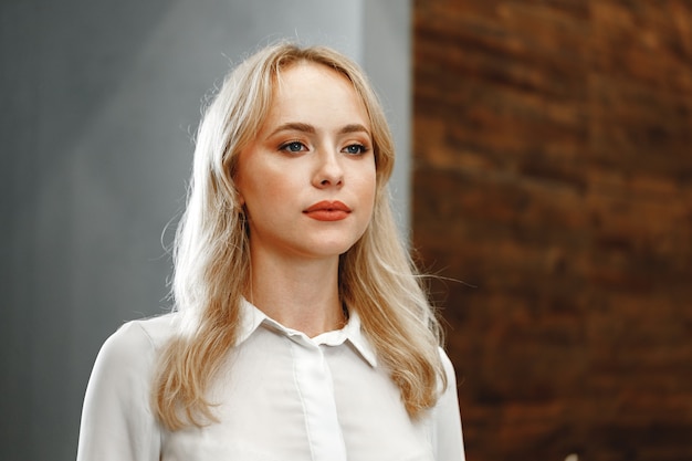 Portrait of caucasian young beautiful woman in formal wear close up