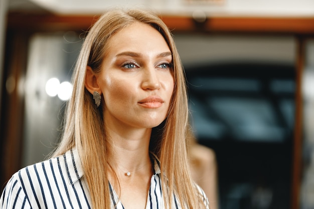 Portrait of caucasian young beautiful woman in formal wear