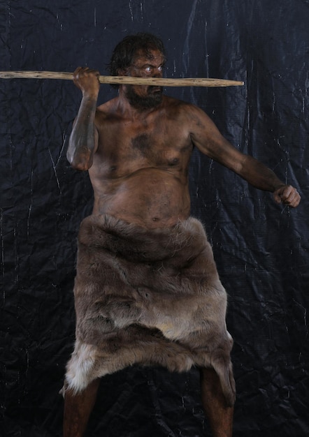 portrait of a caveman with a spear