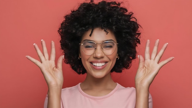 Portrait of charismatic and charming young african woman with curly hair wearing sylish spectacles