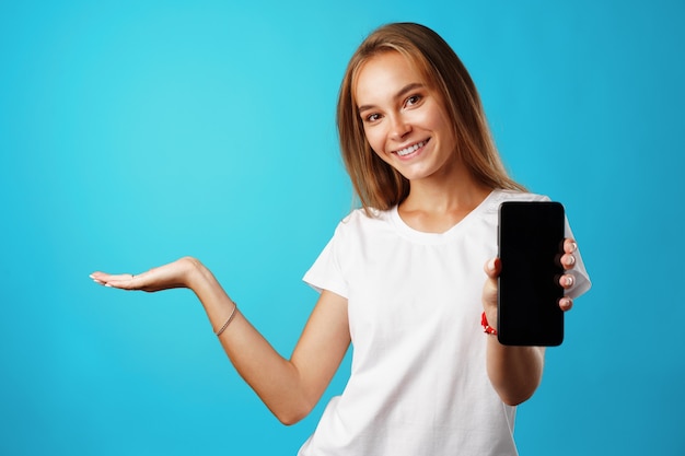 Portrait charming pretty cheerful girl showing copy space close up