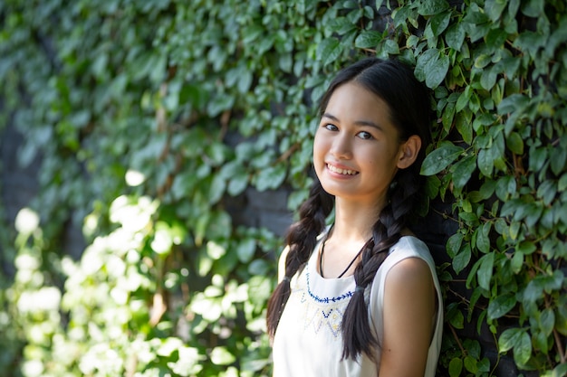 Portrait of charming teenage woman at outdoor.