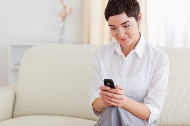 Portrait of a charming woman with a cellphone