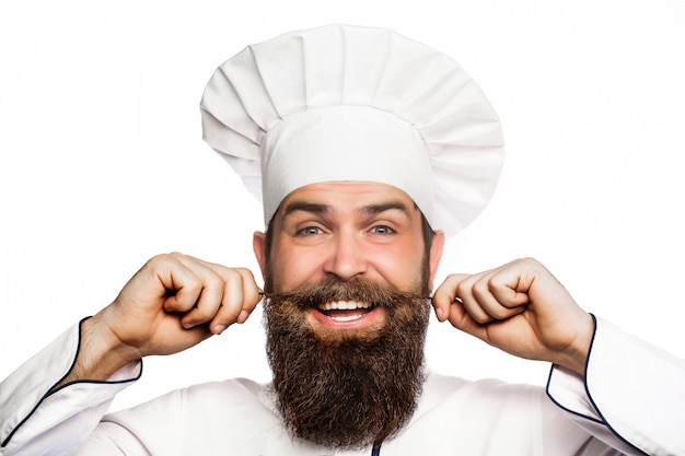 Portrait of a cheerful bearded male chef.