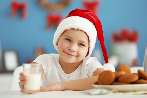 Portrait of cheerful boy in decorated Christmas room, close up