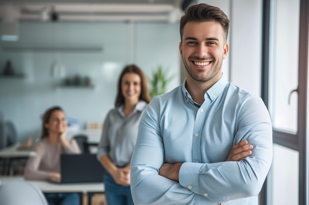 A portrait of a cheerful businessman standing in a conference room with his arms crossed