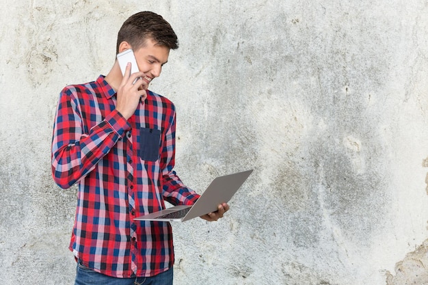 Portrait of a cheerful businessman talking on the phone