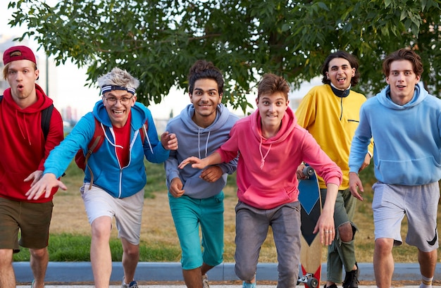 Portrait of cheerful caucasian teenager boys outdoors