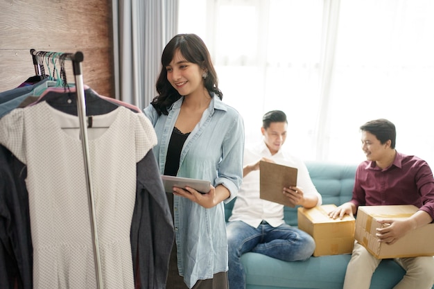 A portrait of a cheerful couple choosing and buying clothes