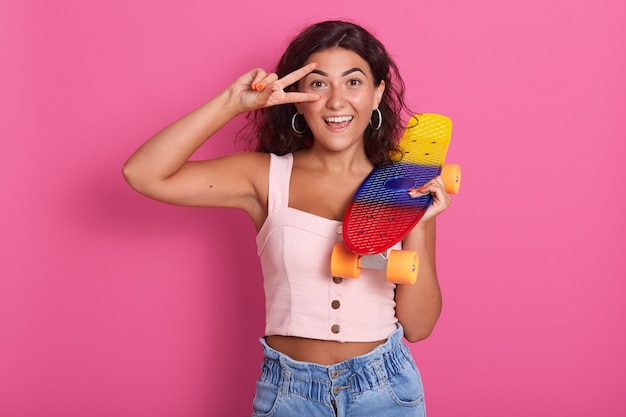 Portrait of cheerful energetic female smiling sincerely