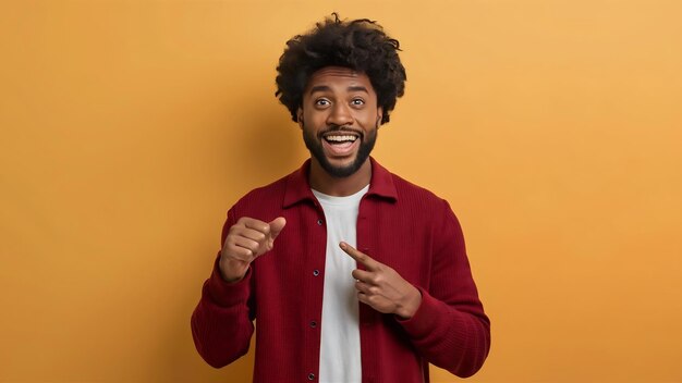 Photo portrait of cheerful excited happy man african american male pointing down seeing good offer specia