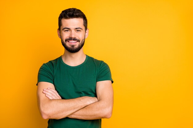 Portrait of cheerful glad guy cross hands isolated over vivid color wall