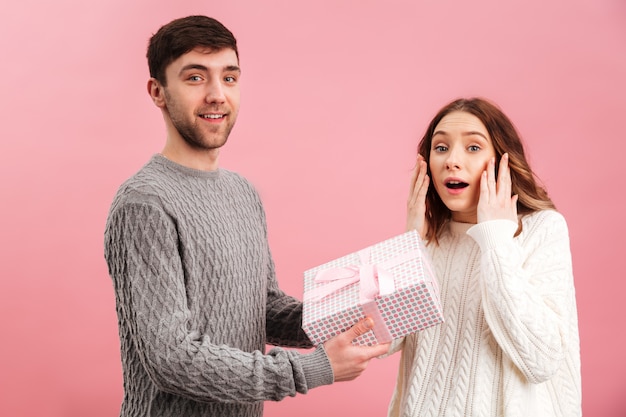 Portrait of cheerful loving couple dressed in sweaters