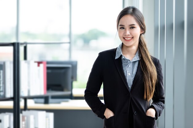 Portrait of a cheerful mature Asian businesswoman at In the office room background,business expressed confidence embolden and successful concept